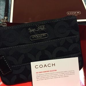 Brand new. Mini Coach wristlet (black)